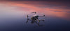 Mavic 4 Pro drone on surface with cloudy background