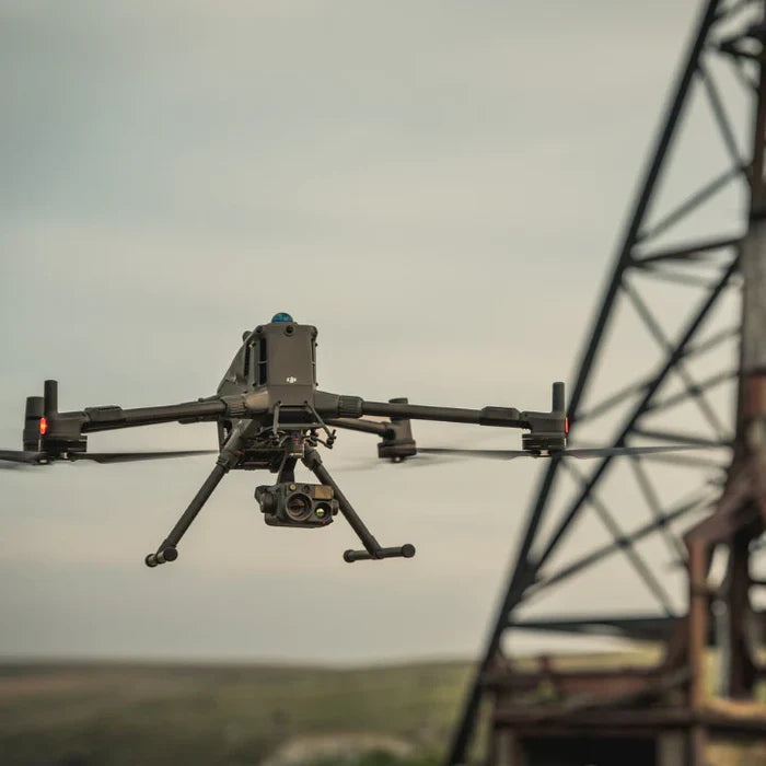 Large enterprise Matrice drone with H30T camera sensor payload flying near power lines