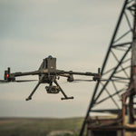 Large enterprise Matrice drone with H30T camera sensor payload flying near power lines