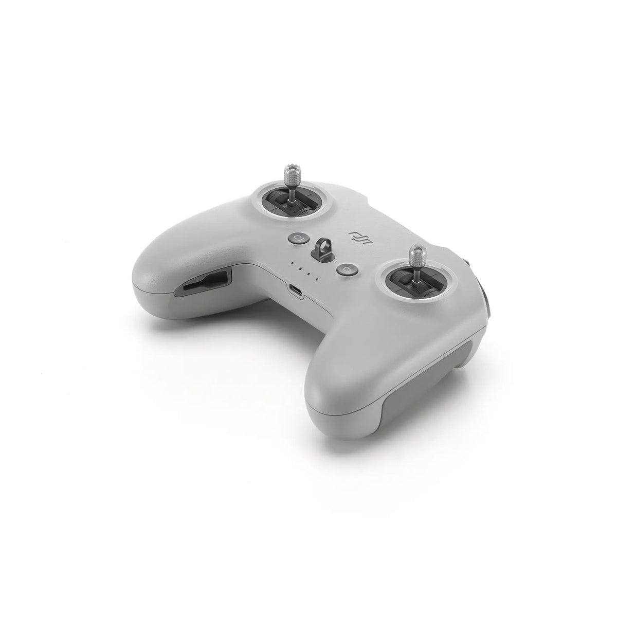 Grey DJI FPV remote control top-down right 45-degree view on white background