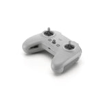Grey DJI FPV remote control top-down right 45-degree view on white background