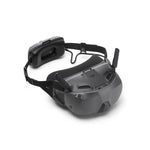 Black DJI FPV goggles shown at 45-degree front right view on a white background