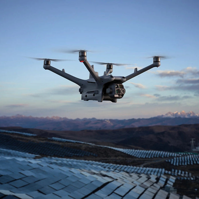 DJI Matrice drone flying with mountainous background