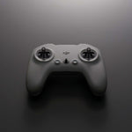 Grey FPV remote control with DJI logo front top-down view on a dark background