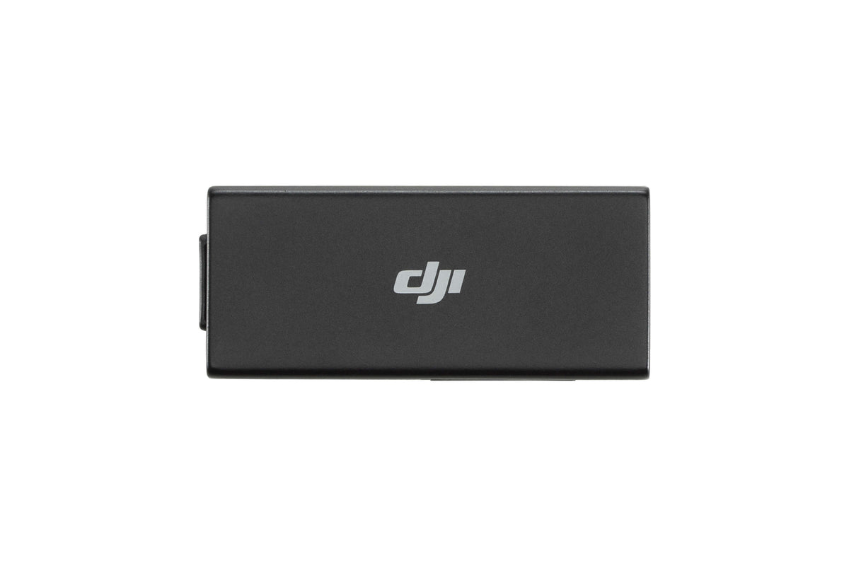 Black rectangular usb cellular dongle with DJI logo birds-eye view on a white background