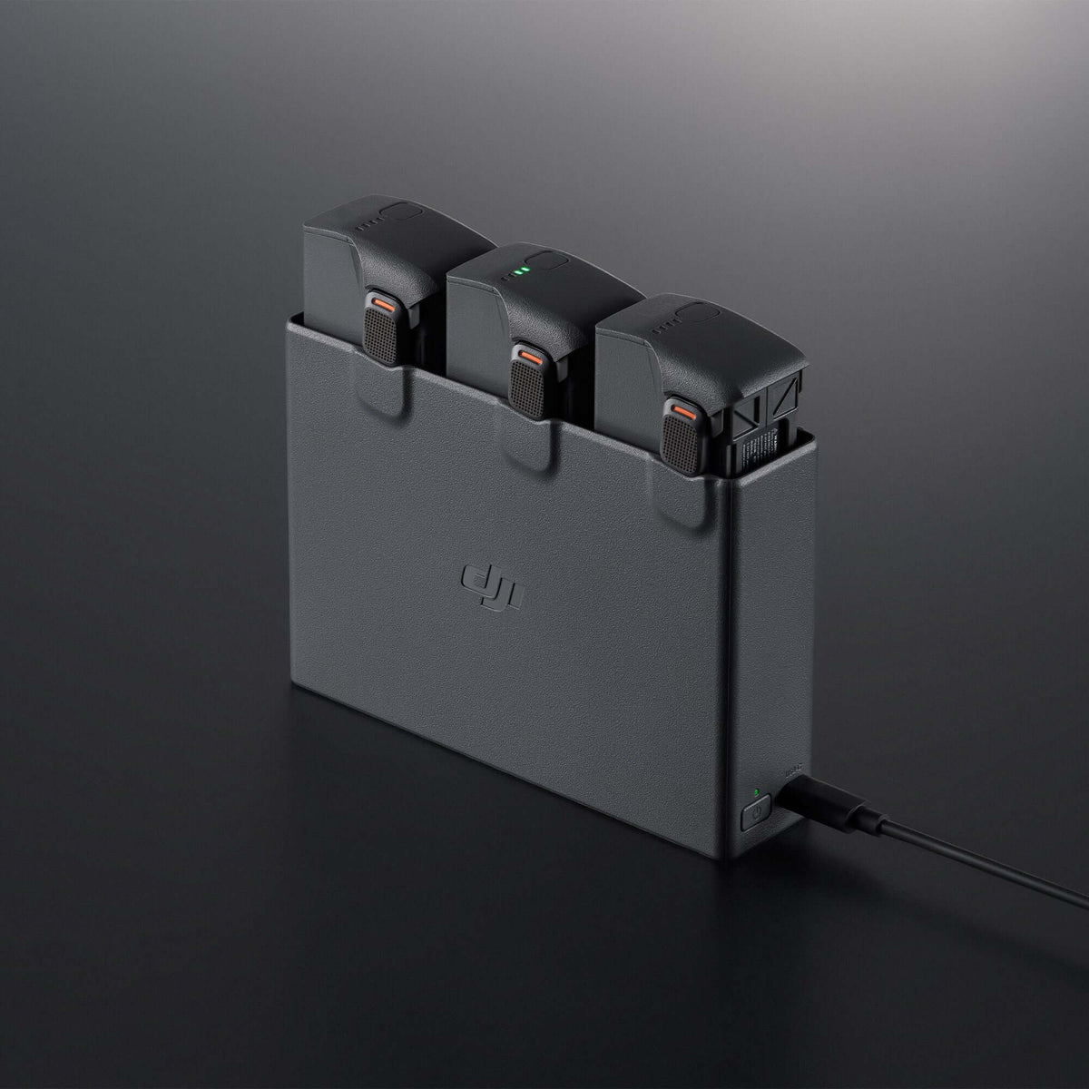 DJI battery charging hub 45-degree front left view on dark background