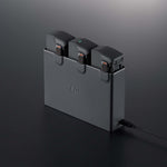 DJI battery charging hub 45-degree front left view on dark background