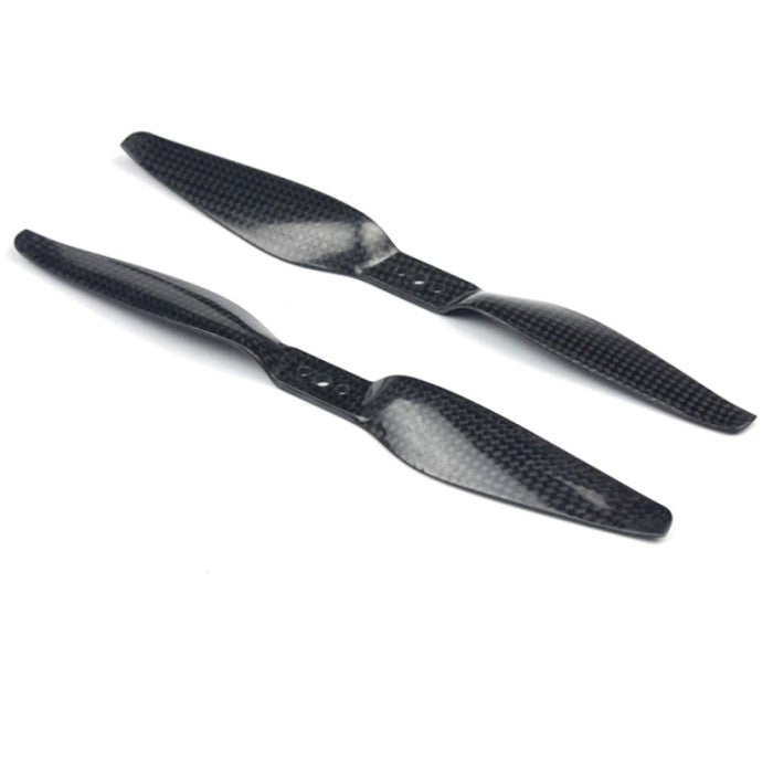 Two black carbon fiber propellers, one with a clockwise rotation and the other with a counter-clockwise rotation, against a white background