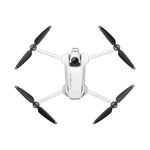 White drone with black propellers birds eye view on a white background