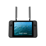 Small remote controller with antennas and a screen displaying water and birds on a white background
