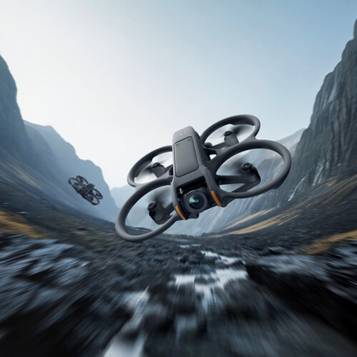 DJI Avata 2 drone flying over a mountainous landscape with a blurred effect
