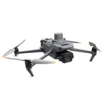 Grey drone with propellers on a white background