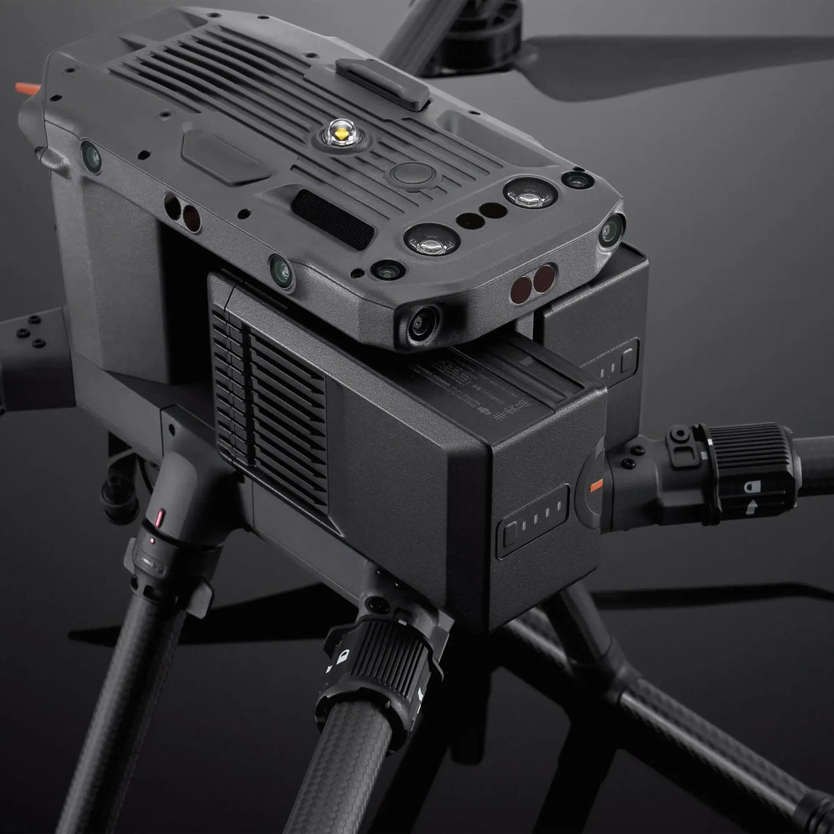 Close-up of a large enterprise drone with TB65 battery being inserted on a dark background