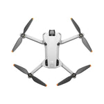 DJI Mini 4 Pro drone unfolded shown at birds-eye view on a white background