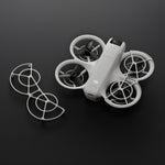 A pair of propeller guard and DJI Neo drone shown at birds-eye view on a dark background