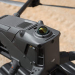 Close-up of a DJI Matrice 400 enterprise drone on a sandy background