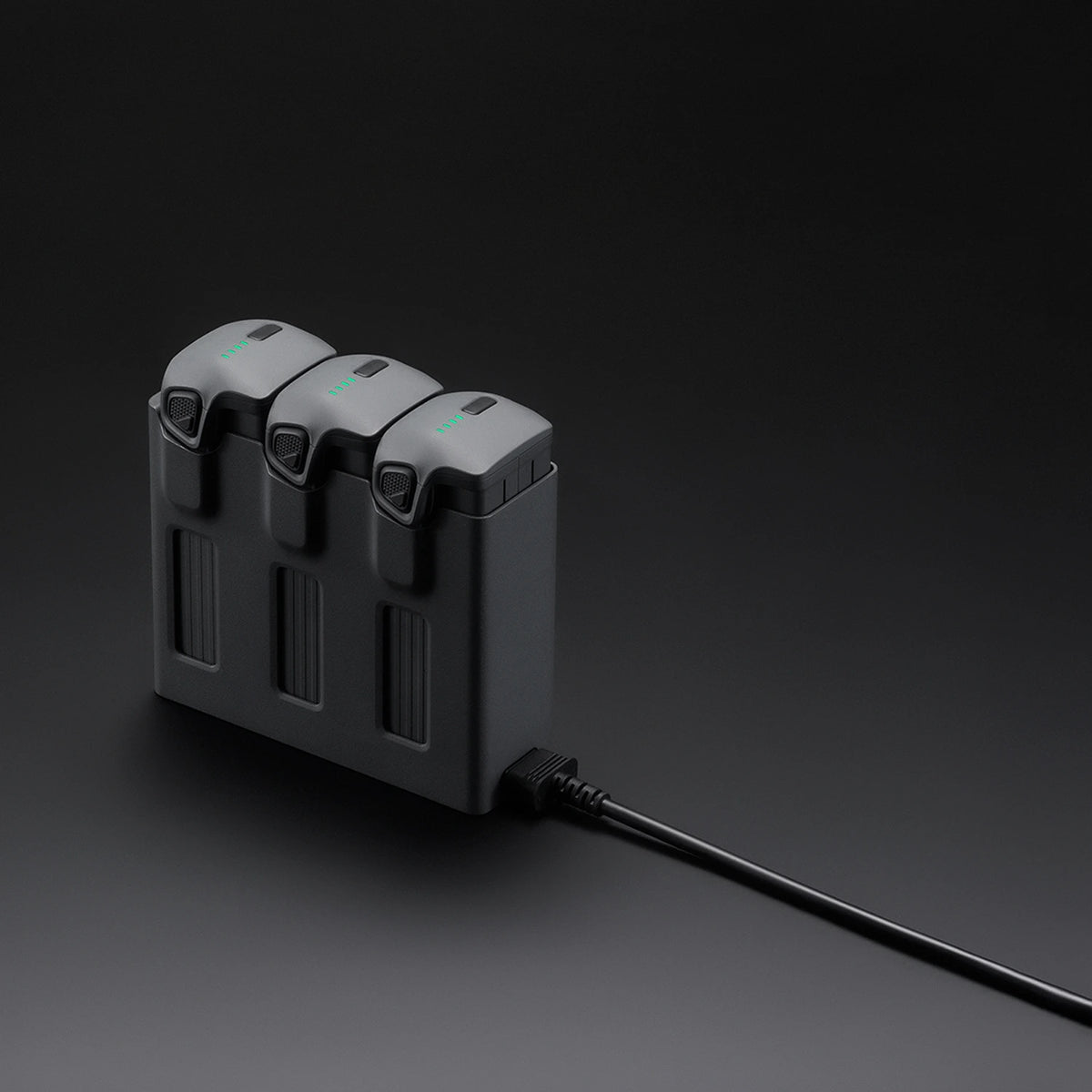 DJI Mavic 4 Pro black parallel charging hub 45-degree front left view on dark background