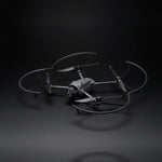Mavic 4 Pro drone with attached propeller guards on a dark background