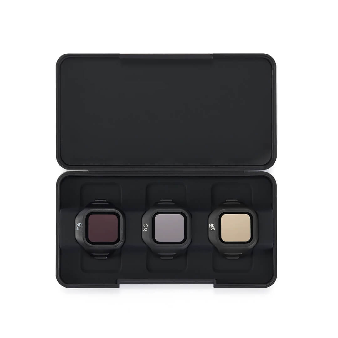 Three camera filters in a black carrying case on a white background