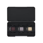 Three camera filters in a black carrying case on a white background
