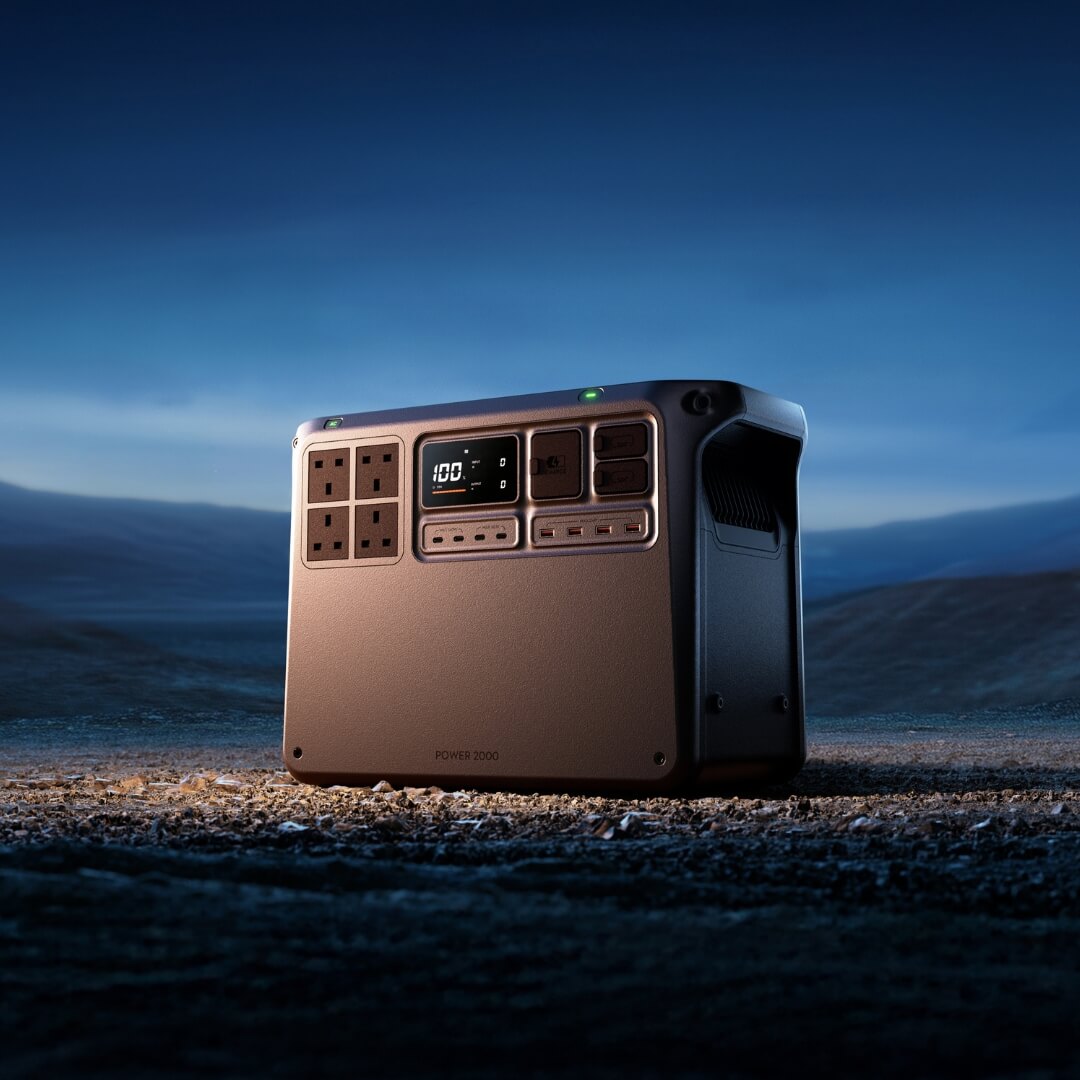 Portable Power 2000 station on a mountainous landscape at night
