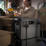 Portable Power 2000 station near table with a person sat in the background