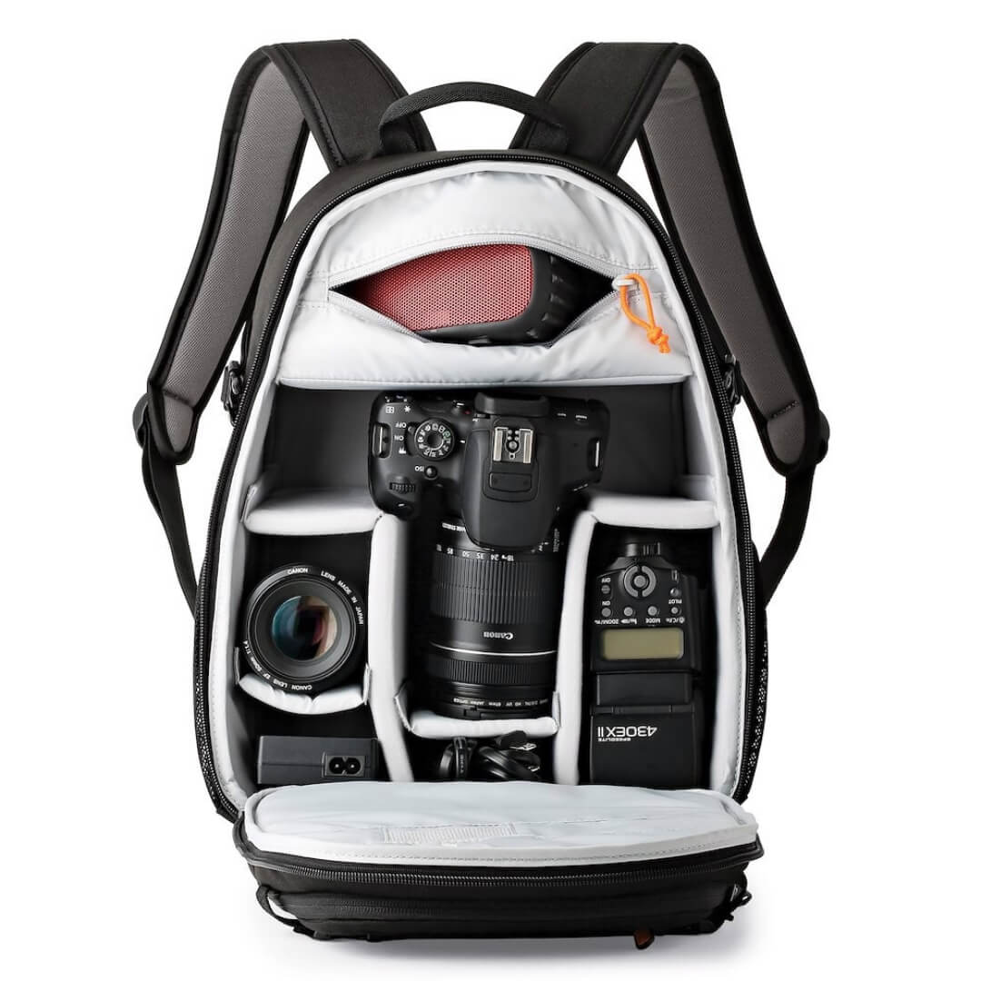 Camera backpack with compartments for camera equipment on a white background