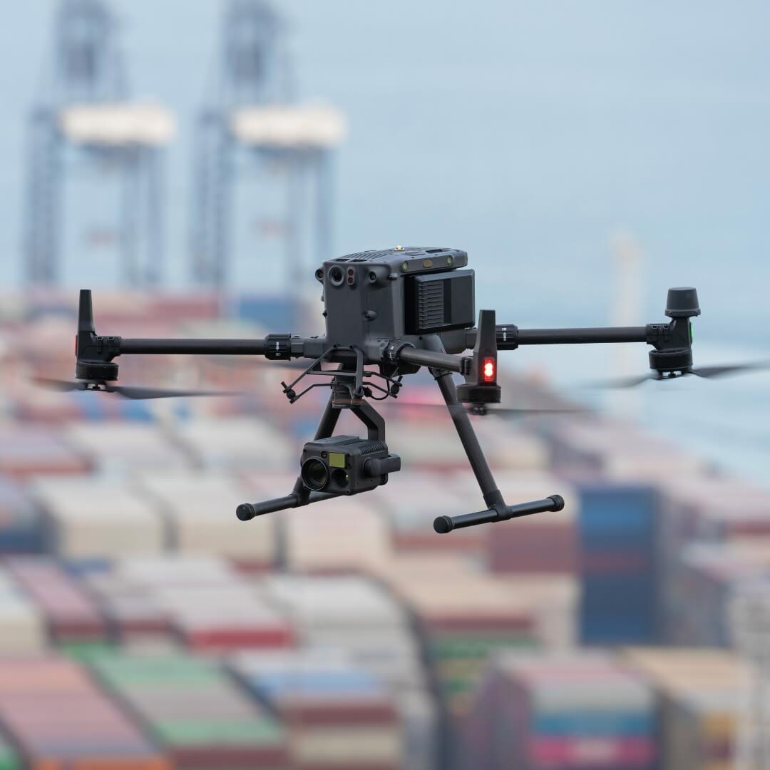 Drones with camera equipment flying over a container yard