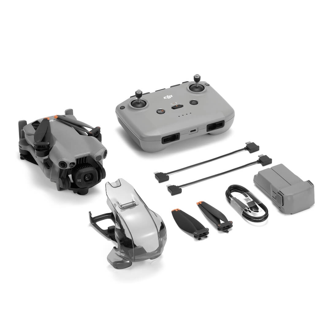 Mini 5 Pro drone with battery, propellors, controller and cables from front right angle on a white background