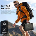 Man hiking with a backpack and carrying a black hard-shell case, set against a mountainous background.