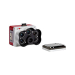 Camera module with multiple lenses and a small rectangular device on a white background