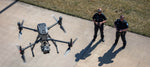Two police officers operating a large enterprise drone