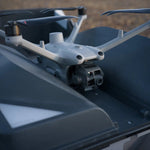 Closeup front view of Matrice drone mounted on the DJi Dock 3 station in an outdoors setting