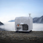 Closed DJI Dock 3 station shown at front view in a snowy setting