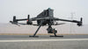DJI Matrice 400 enterprise drone on road surface with camera payload attached to it