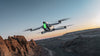 antigravity a1 grey drone flying in the sky with a mountainous background