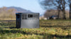 Power station stood on the grass with trees in the background