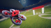 FPV red drone flying through obstable course in American football stadium