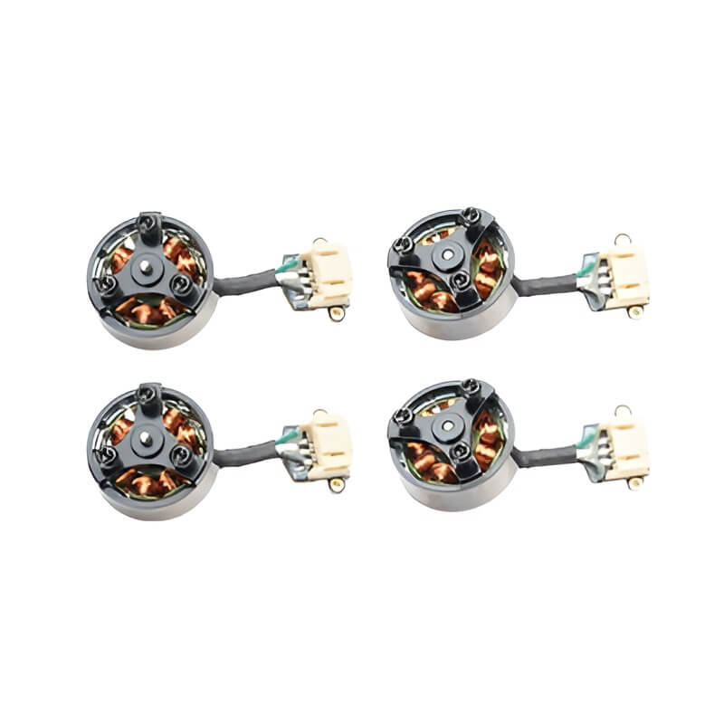 Four brushless motors with connectors on a white background