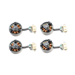 Four brushless motors with connectors on a white background