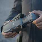 Man inserting battery into a drone