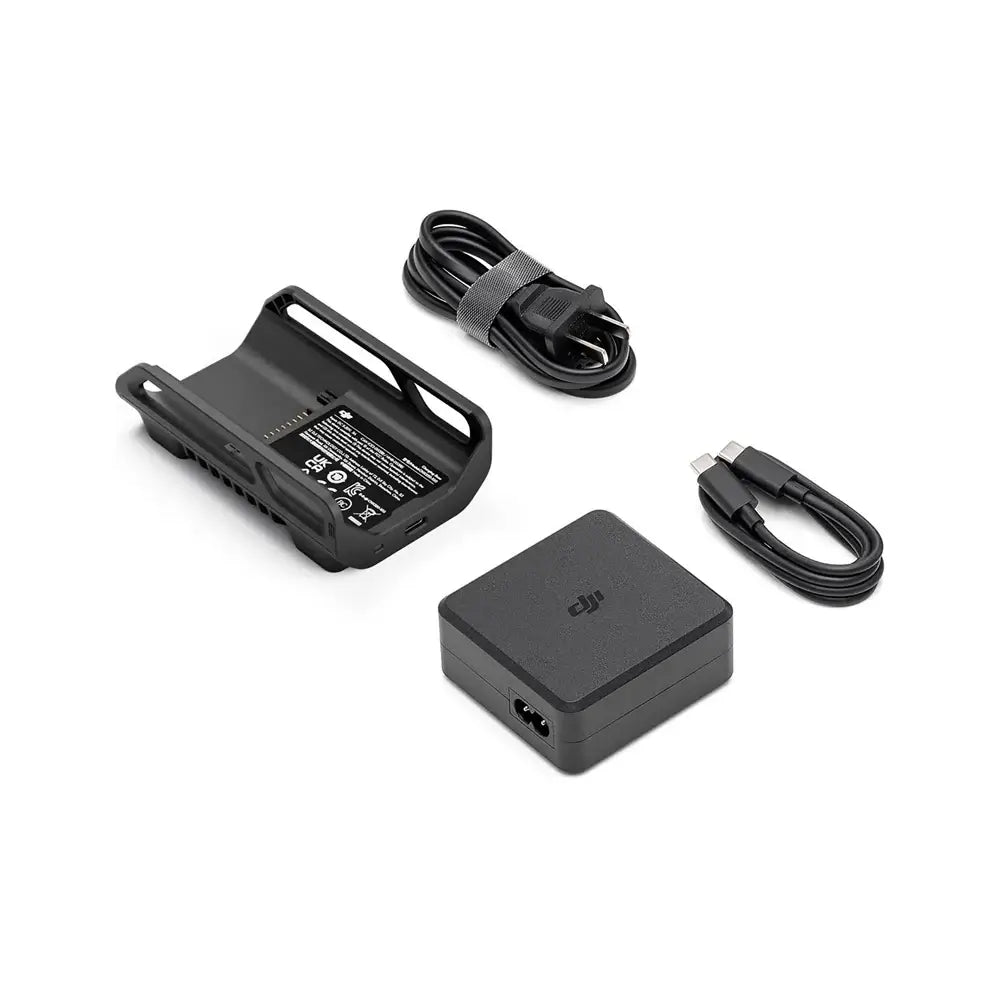 Set of electronic accessories including a power adapter, cables and a small black charging hub with a DJI logo on a white background