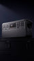 Power station with multiple outlets and buttons on a dark background