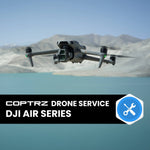 DJI Air Series drone flying over a scenic landscape with mountains and water.