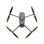 Grey drone with four propellers on a white background