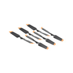 Set of six black and orange spatulas on a white background from side view