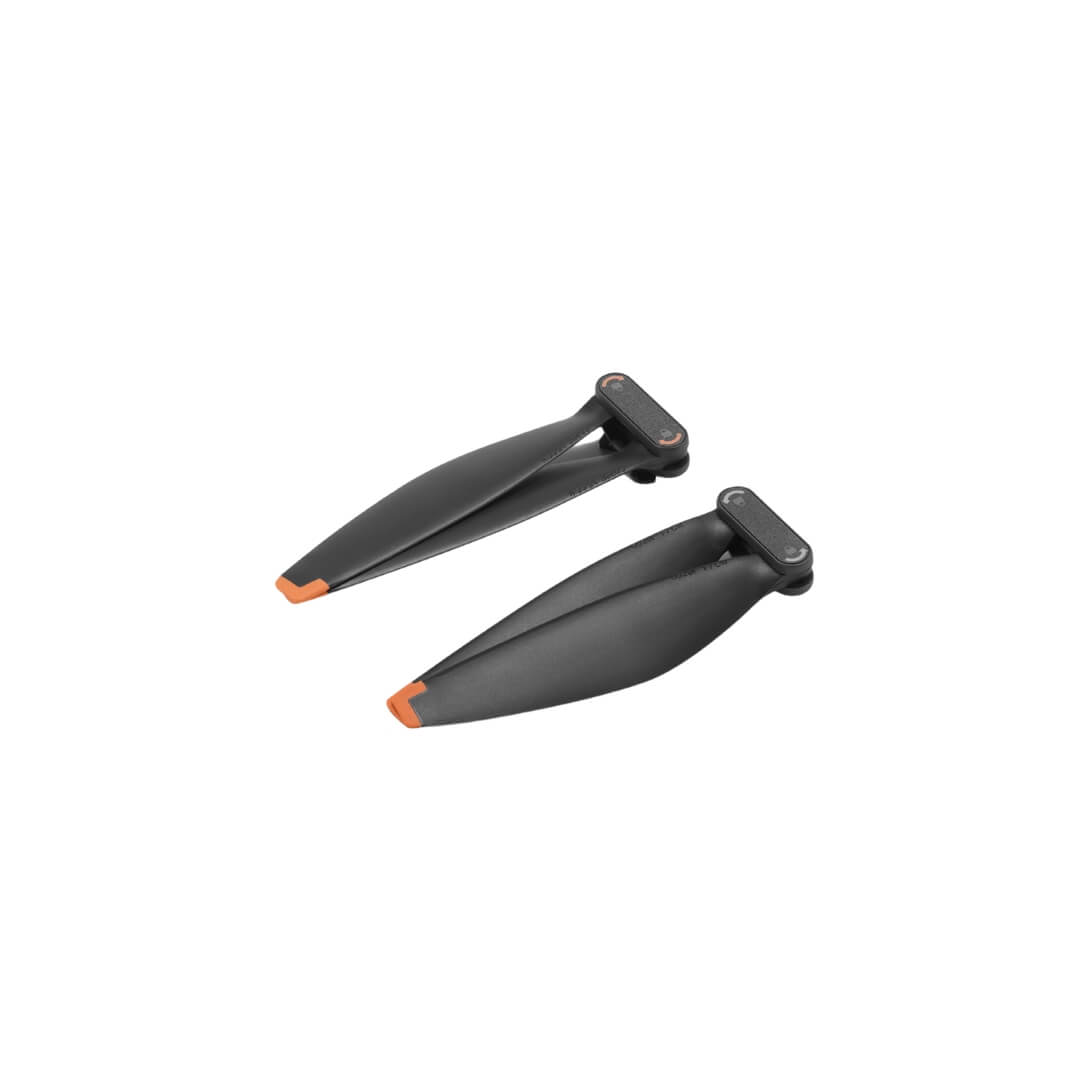Pair of closed black propellers with orange accents on a white background