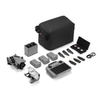 Drone, 3 batteries, remote controller, storage bag and accessories on a white background from front right angle
