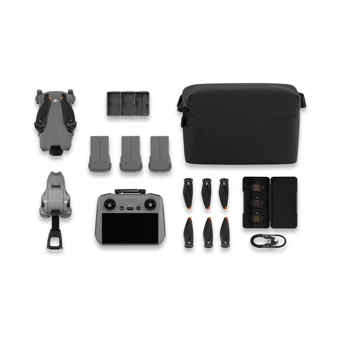 Drone, 3 batteries, remote controller, storage bag and accessories on a white background from birds eye view