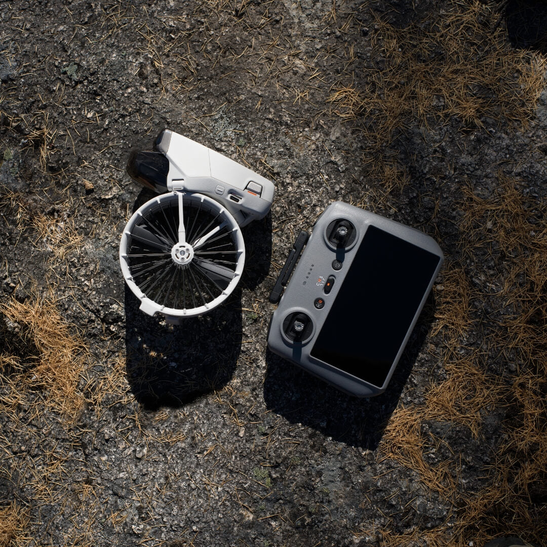 DJI Flip drone folded with RC 2 controller on dry surface